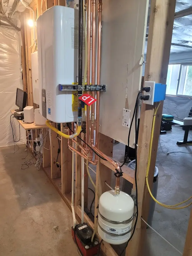 Licensed plumber repairing a kitchen sink in Easton
